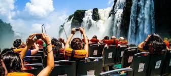 https://www.southamerica.travel/wp-content/uploads/2019/08/iguazu-falls-tour-group-scaled.jpg
